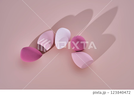 A set of makeup sponges on a pink background. A set of makeup sponges on a pink background. 123840472