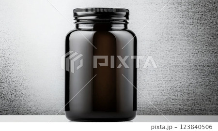 Dark glass jar displayed on a minimalist background 123840506
