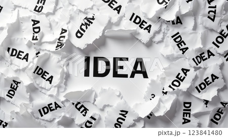 Torn papers printed with "IDEA" 123841480