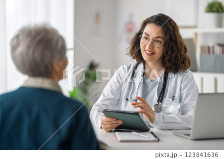 patient with a doctor in medical office 123841636