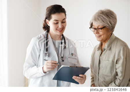 patient with a doctor in medical office patient with a doctor in medical office 123841646