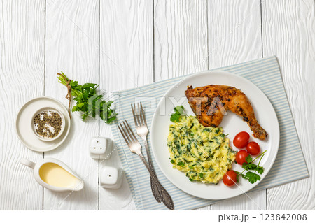 colcannon with kale with roasted chicken leg 123842008