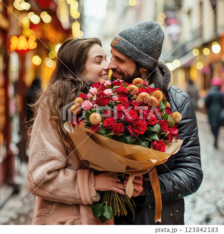 Couple in love with a huge bouquet of flowers 123842183