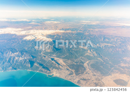 View from the airplane window of the mountains and sea resort with corals in Egypt, Sharm El Sheikh.Flight 123842456