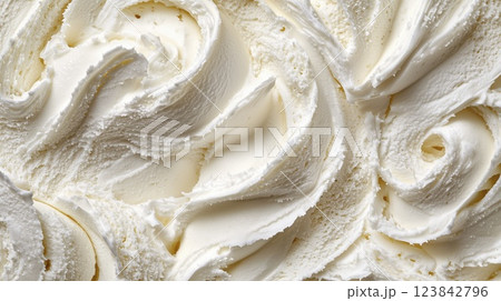 Cream cheese texture close up with smooth swirls and soft structure, top view 123842796