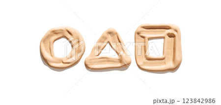 Geometric shapes circle triangle square formed with beige liquid foundation 123842986