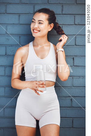 Health, wellness and woman with water bottle for drinking water after exercise, training or workout. Fitness, sports and female from Canada with fresh, refreshing liquid or beverage for hydration. 123843050