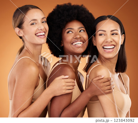 Beauty, happy and skincare women group smile together with healthy, glowing and clean skin. Diverse and natural cosmetic model girls smiling with satisfaction on brown studio background. Beauty, happy and skincare women group smile together with healthy, glowing and clean skin. Diverse and natural cosmetic model girls smiling with satisfaction on brown studio background. 123843092