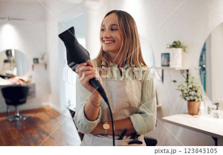 Salon, hairdresser and woman with hairdryer for professional styling thinking and holding equipment. Smile of happy hair grooming girl with stylist expert heat tool enjoying calm contemplating moment 123843105