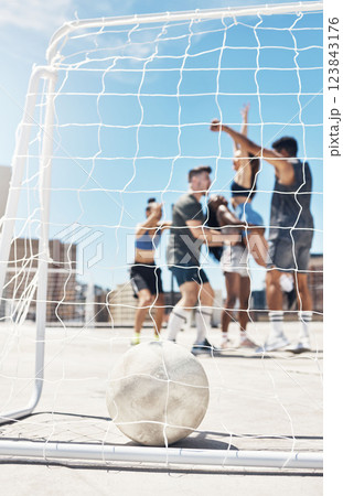 Football, soccer team and ball in goal post or net with diversity sports group of men and women in celebration of win, winning and scoring on urban rooftop. Exercise, concrete training and champions Football, soccer team and ball in goal post or net with diversity sports group of men and women in celebration of win, winning and scoring on urban rooftop. Exercise, concrete training and champions 123843176