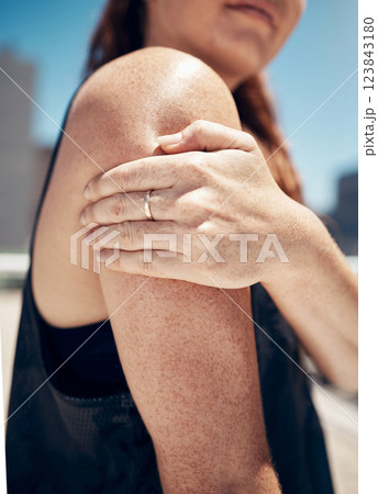 Arm, shoulder and exercise woman injury, athlete training, and fitness workout in outdoor urban city. Closeup joint pain problem, muscle anatomy accident and body healthcare risk of sports emergency 123843180