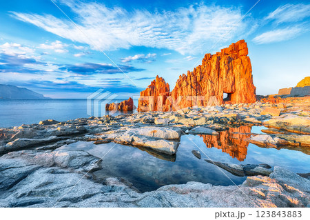 Impressive sunset view of Red Rocks (Rocce Rosse) in Arbatax. Impressive sunset view of Red Rocks (Rocce Rosse) in Arbatax. 123843883