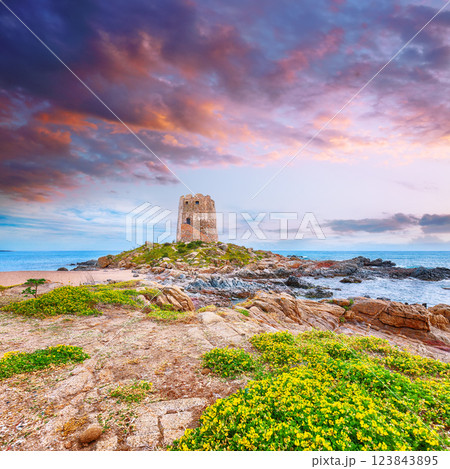Exciting sunset view of Bari Sardo tower in the Gulf of Orosei. Exciting sunset view of Bari Sardo tower in the Gulf of Orosei. 123843895