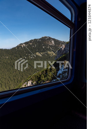 Cog railway window view with mountain peaks in the Bavarian Alps, Germany 123844874
