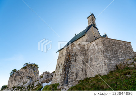 Stone church on a mountaintop in the Bavarian Alps on a sunny day in summer 123844886