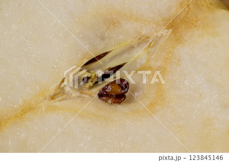 ripe white pear with a yellow colour on the table 123845146