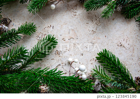 Christmas tree spruce for frame with decor on the wood background. Copy space. Top view.  123845190