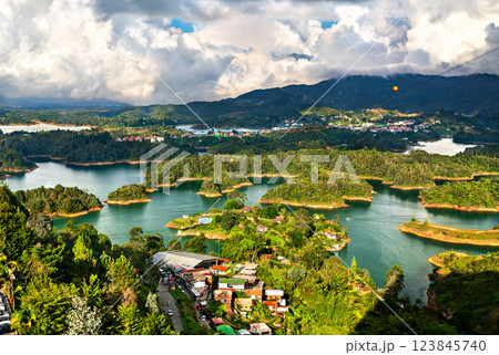 Aerial view of Penol-Guatape Reservoir in Colombia, showcasing its vibrant landscapes lush green hills and a network of shimmering turquoise lakes 123845740