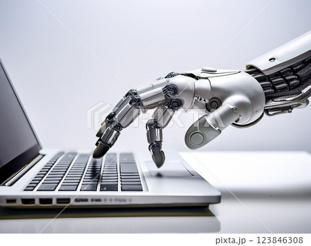 ノートパソコンのキーボードを操作するロボットアーム 123846308