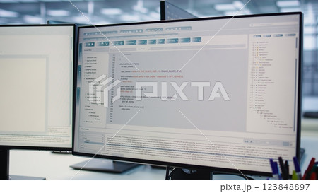 Computers in data center hosting rackmount ensuring faultless operations conditions. Close up of PC monitors on desk used for monitoring data center devices energy consumption 123848897