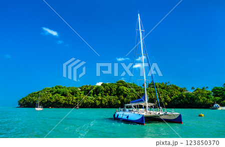 Catamaran for Kourou at Ile Royale, the Salvation Islands in French Guiana, South America Catamaran for Kourou at Ile Royale, the Salvation Islands in French Guiana, South America 123850370