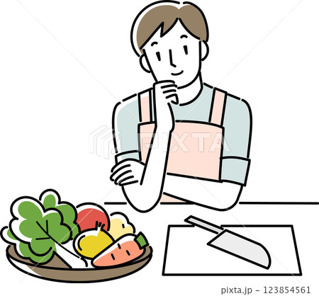 献立を考えるエプロンを着けた男性 123854561