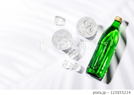 Crystal-clear glasses filled with chilled water and ice cubes Crystal-clear glasses filled with chilled water and ice cubes 123855214
