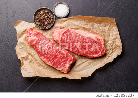 Raw marbled striploin steak, fresh, rich, ready for cooking Raw marbled striploin steak, fresh, rich, ready for cooking 123855237