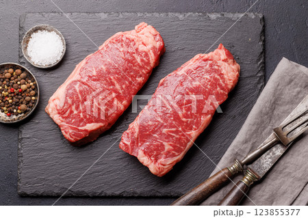 Raw marbled striploin steak, fresh, rich, ready for cooking Raw marbled striploin steak, fresh, rich, ready for cooking 123855377