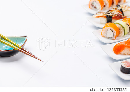 Assorted sushi and maki rolls beautifully arranged on plates Assorted sushi and maki rolls beautifully arranged on plates 123855385