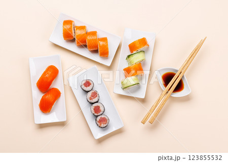 Assorted sushi and maki rolls beautifully arranged on plates 123855532
