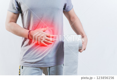 Person with diarhea holding toilet paper roll. Diarhea and stomach problems concept Person with diarhea holding toilet paper roll. Diarhea and stomach problems concept 123856156