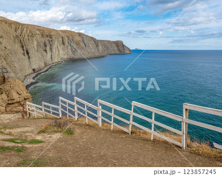 fence on top of the mountain, rocks, sea 123857245