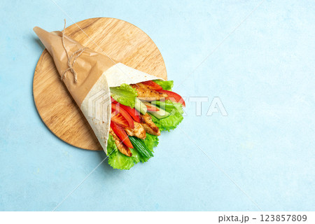 Grilled chicken wrap with fresh vegetables. Fajita wrap. Grilled chicken wrap with fresh vegetables. Fajita wrap. 123857809