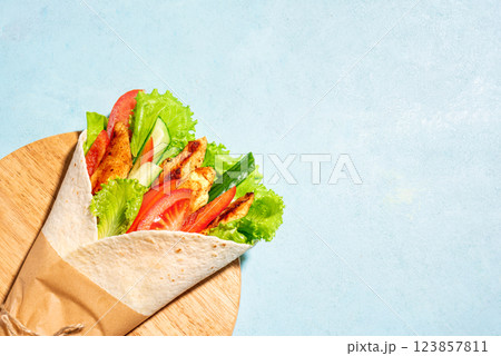 wrap grilled chicken sandwich with vegetables wrap grilled chicken sandwich with vegetables 123857811
