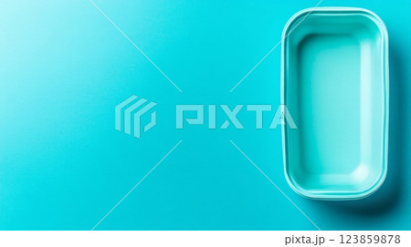 Empty Turquoise Food Container on Teal Background 123859878