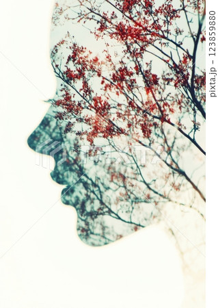 Silhouette of a woman's head created by the branches of a tree 123859880