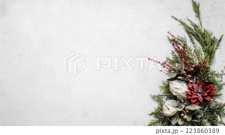 Winter foliage with red poinsettia decor 123860389