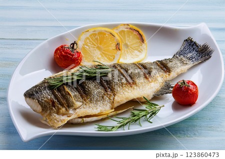 Grilled Fish Garnished with Lemon and Herbs 123860473