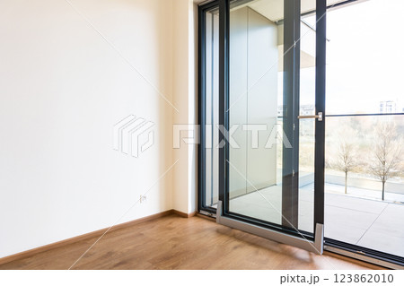 Tilt and slide glass door system for modern balcony access in residential apartment interior 123862010