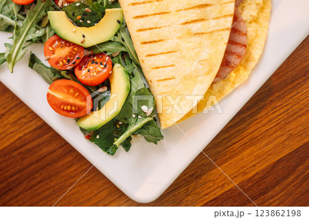 Toasted Tortilla with Sausage for Breakfast Toasted Tortilla with Sausage for Breakfast 123862198