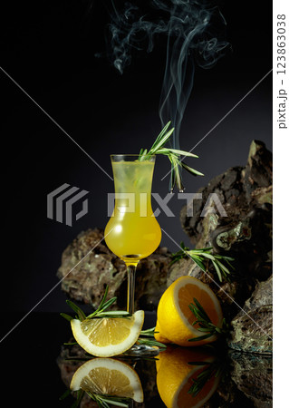Traditional homemade lemon liqueur limoncello on the black background. 123863038