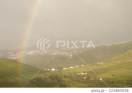 Rainbow over Valle Jimenez. 123865036