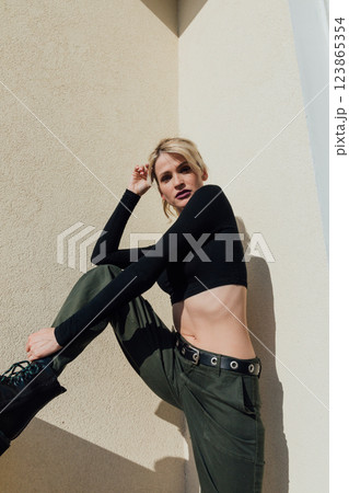 Beautiful fashion blonde woman in military clothes Beautiful fashion blonde woman in military clothes 123865354