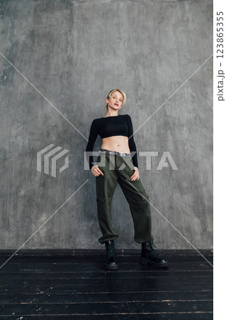 Beautiful fashion blonde woman in military clothes Beautiful fashion blonde woman in military clothes 123865355