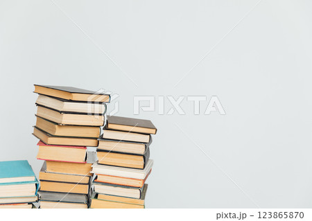 Stacks of old educational books on a white background of a school library 123865870