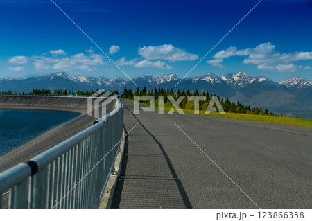 The most famous Slovak peak in the High Tatras - Krivan. A view of the Cierny Vah hydroelectric power plant. 123866338