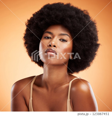 Skincare, portrait and black woman with face makeup against an orange studio background. Young, african and beauty girl model with glow from cosmetics, healthy body and care for skin with dermatology Skincare, portrait and black woman with face makeup against an orange studio background. Young, african and beauty girl model with glow from cosmetics, healthy body and care for skin with dermatology 123867451