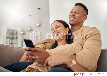 Phone, happy and couple on a social media meme internet page or website online laughing at funny content. Smile, subscription and young woman loves bonding and streaming comedy with partner at home 123867553