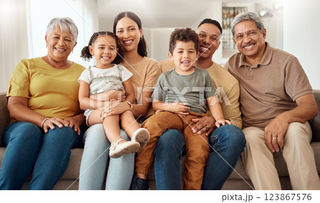 Relax, smile and big family on the sofa in the living room of their house for love, happiness and care. Portrait of happy and young kids with grandparents, mother and father on the sofa for bonding 123867576
